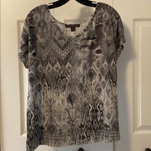 grey and white blouse.